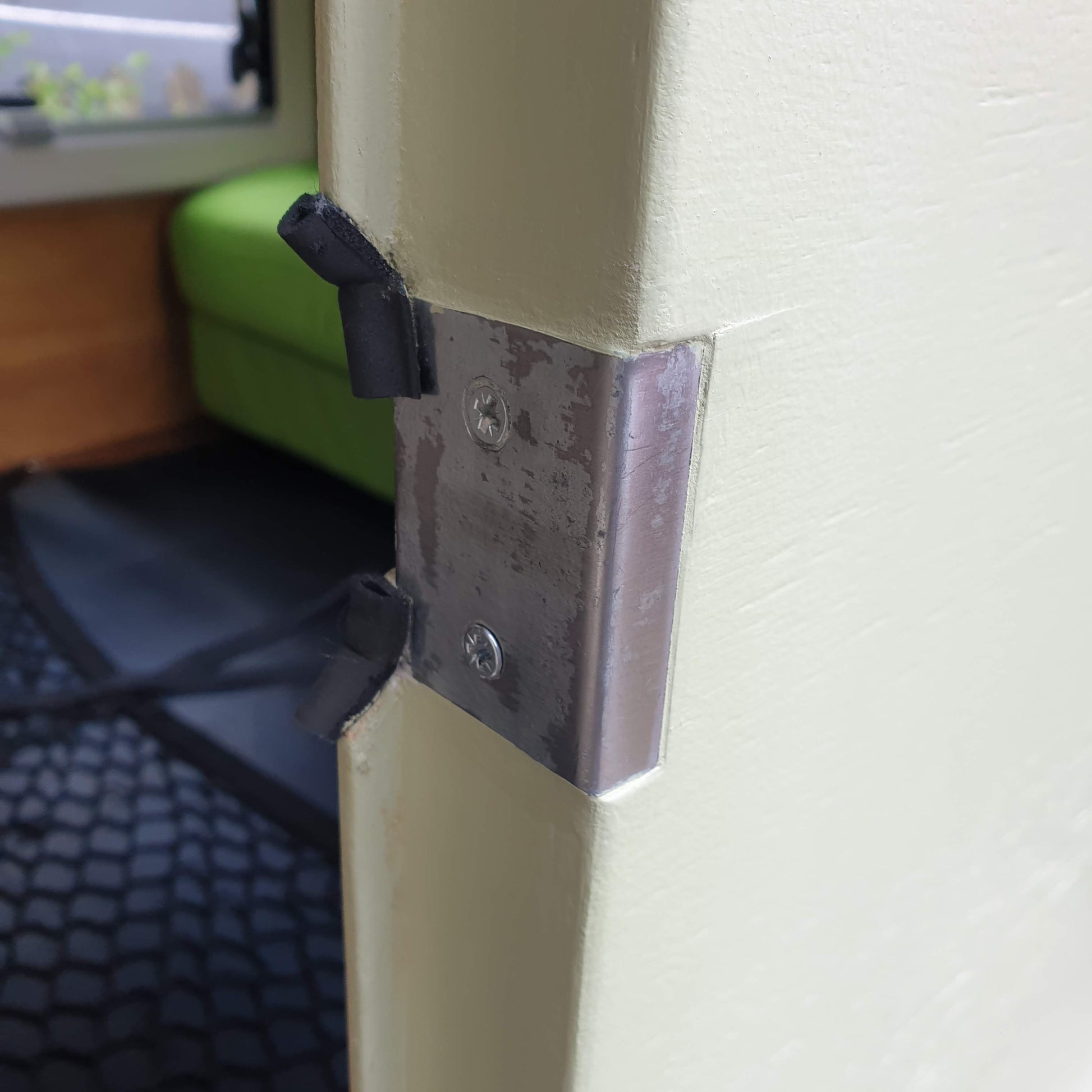 Protective steel plate to prevent door frame damage